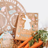 A wooden Rich Design Co Easter Bunny Countdown Sign with Dry Erase Bunny gift box, crafted from durable board and UV printed with a delightful bunny design adorned with carrots.